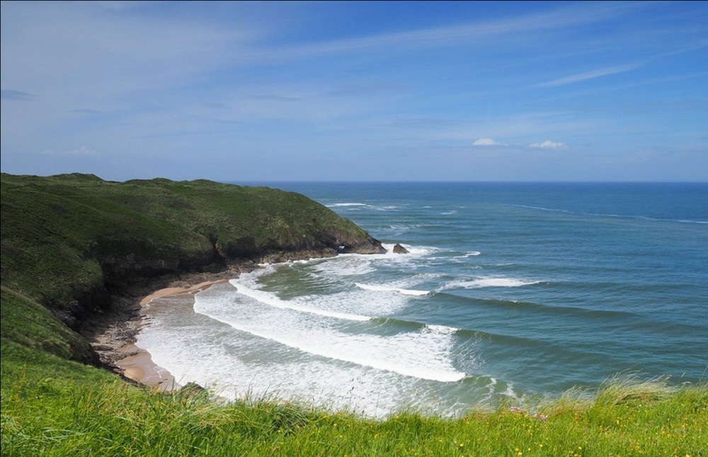 Natural rock pool revealed at low tide in Blue Pool Bay