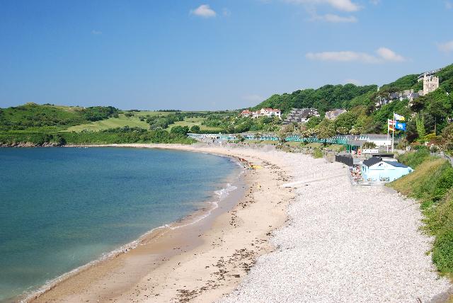 Beach huts along the promenade at Langland Bay