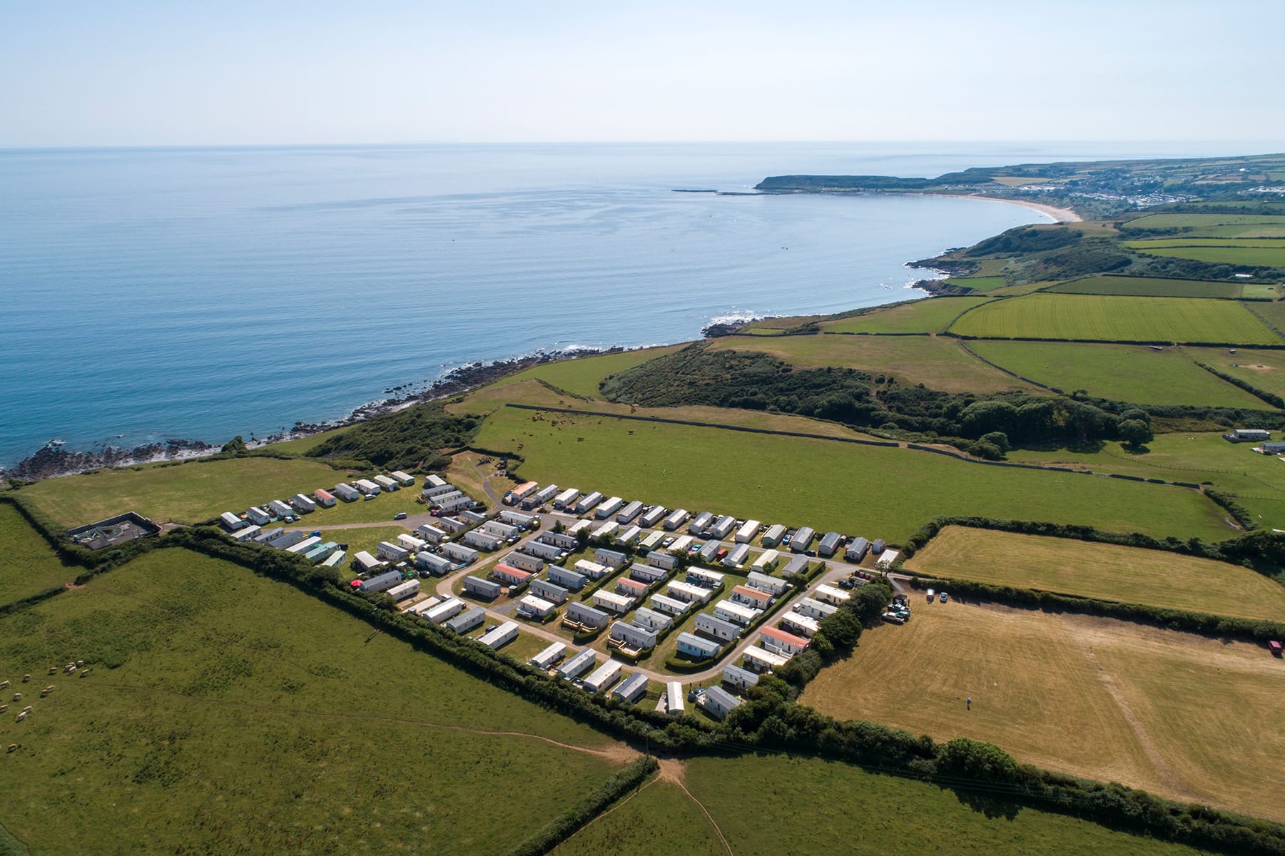 Luxury lodges at Green Meadow overlooking Oxwich Bay
