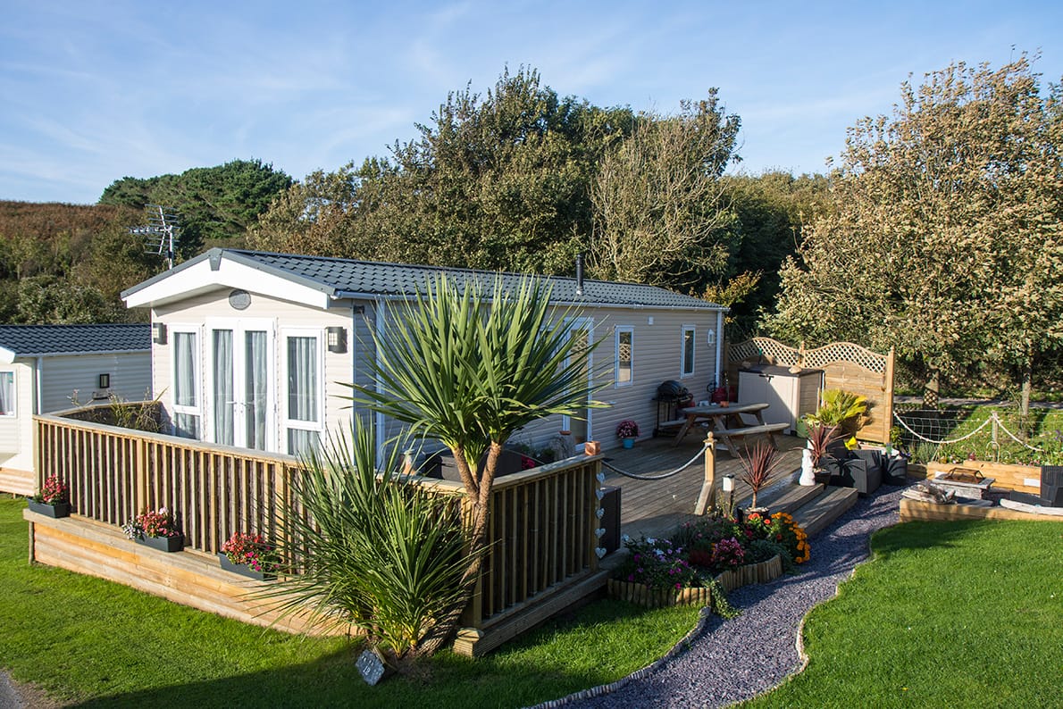 Peaceful caravan pitches and gardens at Whiteford Bay Holiday Park